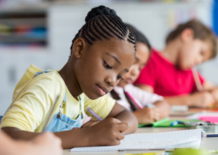 students doing work in a classroom setting